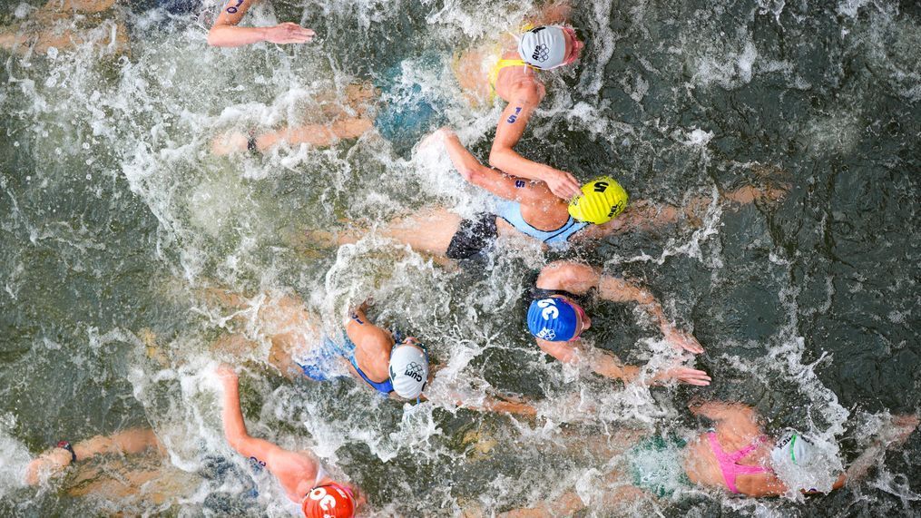 FILE - Australia's Natalie Van Coevorden (15), Belgium's Claire Michel (5) and Ekaterina Shabalina, of Kazakhstan (32) compete in the swim leg of the women's individual triathlon competition at the 2024 Summer Olympics, Wednesday, July 31, 2024, in Paris, France. (AP Photo/David Goldman, File)