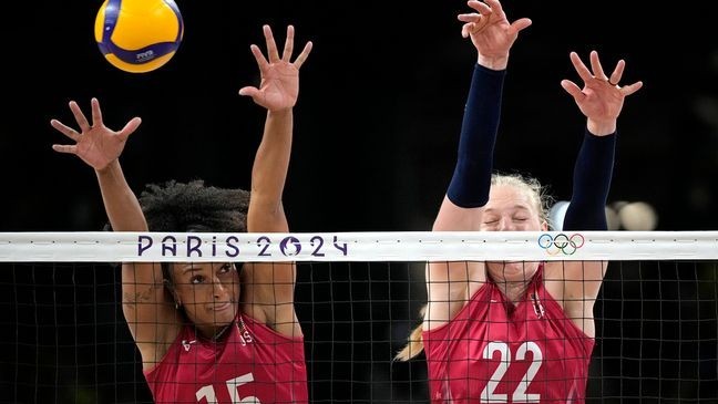 United States' Haleigh Washington (15) and Kathryn Plummer (22) attempt to block a ball during a semifinal women's volleyball match against Brazil at the 2024 Summer Olympics, Thursday, Aug. 8, 2024, in Paris, France. (AP Photo/Alessandra Tarantino)