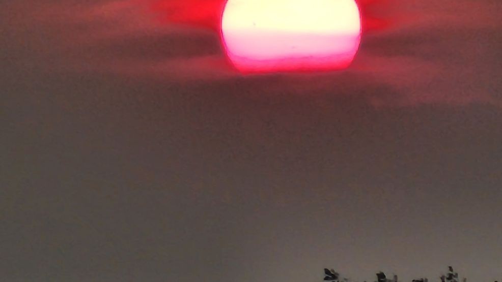 Smoke colors the sun red on Aug. 7, 2024. (Photo submitted at kutv.com/chimein by Deb Hansen)