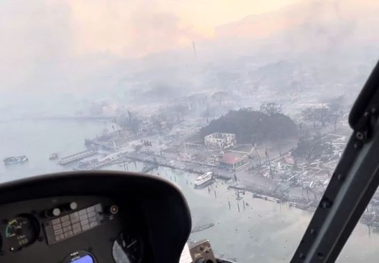 Image for story: 'Still strikes you': Helicopter pilot revisits Lahaina one year after deadly Maui fire