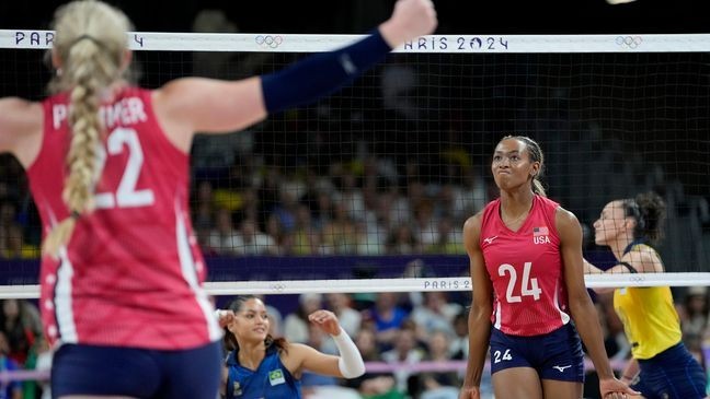 United States' Kathryn Plummer (22) and Chiaka Ogbogu (24) celebrate after scoring a point during a semifinal women's volleyball against Brazil match at the 2024 Summer Olympics, Thursday, Aug. 8, 2024, in Paris, France. (AP Photo/Dolores Ochoa)