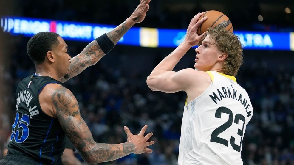 FILE - Utah Jazz forward Lauri Markkanen (23) looks for an opening against Dallas Mavericks defender P.J. Washington (25) during an NBA basketball game in Dallas, March 21, 2024. (AP Photo/LM Otero, File)