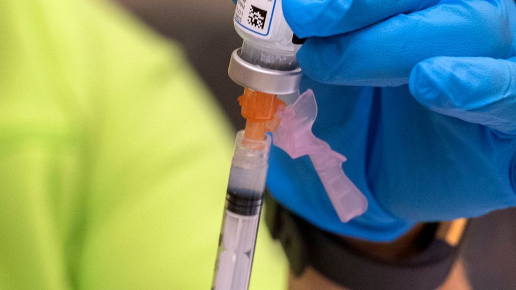 A nurse with Mount Rogers Health District, Virginia Department of Health, draws a dose of the Moderna vaccine (David Crigger/Bristol Herald Courier via AP)