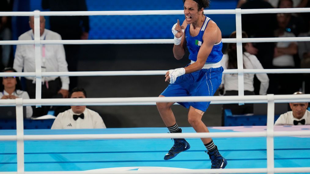 Algeria's Imane Khelif celebrates after defeating Thailand's Janjaem Suwannapheng in their women's 66 kg semifinal boxing match at the 2024 Summer Olympics, Tuesday, Aug. 6, 2024, in Paris, France. (AP Photo/Ariana Cubillos)