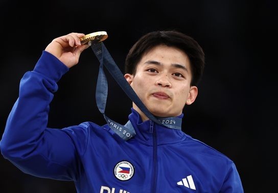 Image for story: Gymnast wins condo and food for life after becoming his country's first male gold medalist