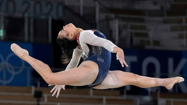 FILE - Sunisa Lee, of the United States, performs on the floor during the artistic gymnastics women's all-around final at the 2020 Summer Olympics, July 29, 2021, in Tokyo. (AP Photo/Gregory Bull, File)