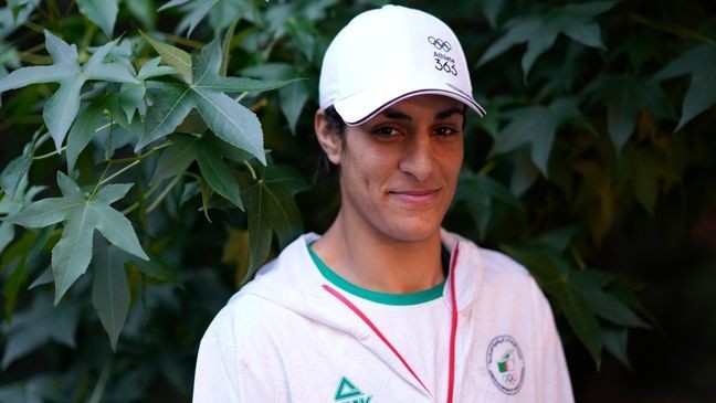 Algerian boxer Imane Khelif poses for a photo after an interview with SNTV at the 2024 Summer Olympics, Sunday, Aug. 4, 2024, in Paris, France. (AP Photo/Vadim Ghirda)