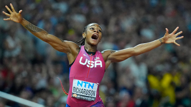 FILE - Sha'Carri Richardson, of the United States, celebrates after winning the gold medal in the final of the women's 100-meters during the World Athletics Championships in Budapest, Hungary, Aug. 21, 2023. (AP Photo/Petr David Josek, File)