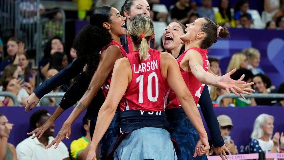 Players for the United States celebrate during a semifinal women's volleyball match against Brazil at the 2024 Summer Olympics, Thursday, Aug. 8, 2024, in Paris, France. (AP Photo/Dolores Ochoa)