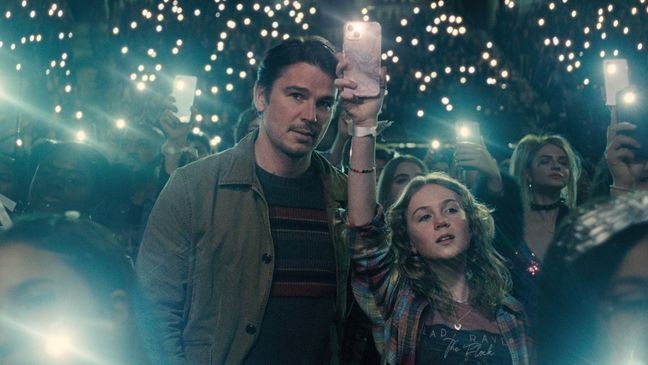 This image released be Warner Bros. Pictures shows Josh Hartnett, left, and Ariel Donoghue in a scene from "Trap." (Warner Bros. Pictures via AP)