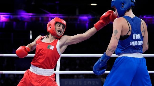 Algeria's Imane Khelif hits Hungary's Anna Hamori in their women's 66kg quarterfinal boxing match at the 2024 Summer Olympics, Saturday, Aug. 3, 2024, in Paris, France. (AP Photo/John Locher)